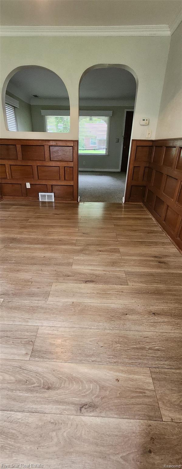 20120 Rensellor St, Livonia, MI 48152 - hall with light wood finished floors and ornamental molding