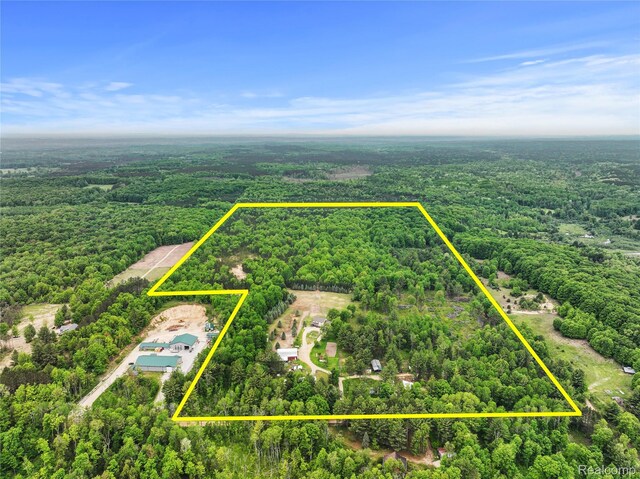 8875 N Lakola Rd, Tustin, MI 49688 - view of property location featuring a forest and property parcel outlined