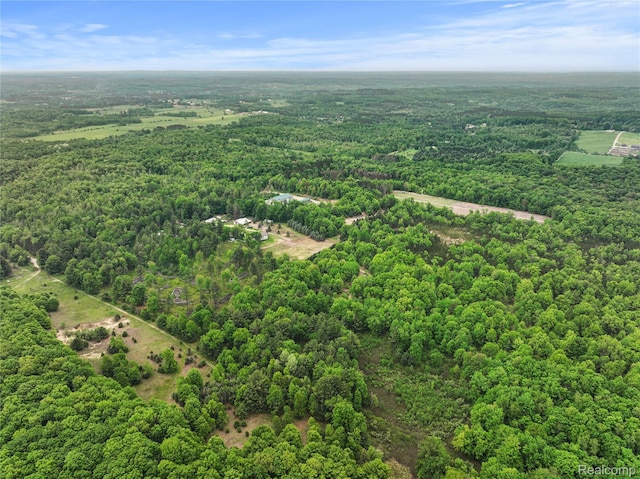8875 N Lakola Rd, Tustin, MI 49688 - aerial overview of property's location with a heavily wooded area