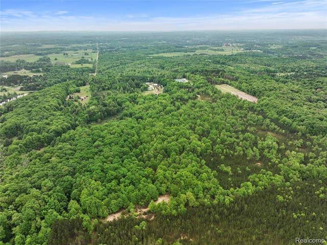 8875 N Lakola Rd, Tustin, MI 49688 - aerial view of a heavily wooded area