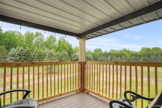 8875 N Lakola Rd, Tustin, MI 49688 - wooden terrace with a lawn