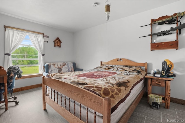 8875 N Lakola Rd, Tustin, MI 49688 - bedroom with baseboards and tile patterned floors