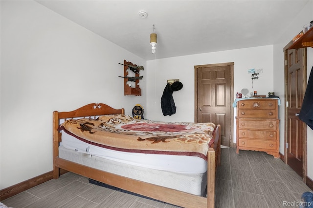 8875 N Lakola Rd, Tustin, MI 49688 - bedroom with baseboards