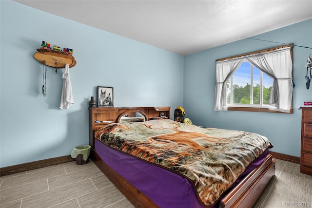 8875 N Lakola Rd, Tustin, MI 49688 - bedroom with baseboards