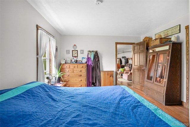 8875 N Lakola Rd, Tustin, MI 49688 - bedroom featuring wood finished floors