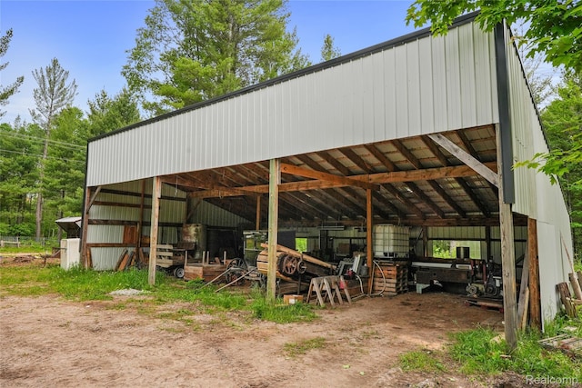 8875 N Lakola Rd, Tustin, MI 49688 - view of vehicle parking with a pole building