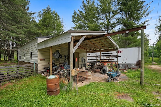 8875 N Lakola Rd, Tustin, MI 49688 - view of patio / terrace with a carport
