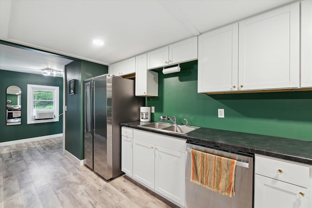 3701 3 1/2 Mile Rd, Athens, MI 49011 - kitchen featuring stainless steel appliances, a sink, dark countertops, and white cabinets
