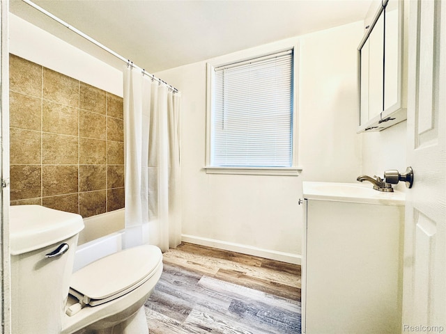 38204 Main St, New Baltimore, MI 48047 - full bath featuring wood finished floors, vanity, toilet, shower / tub combo with curtain, and baseboards
