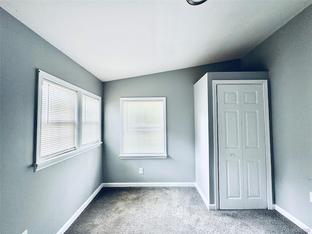 38204 Main St, New Baltimore, MI 48047 - unfurnished bedroom featuring vaulted ceiling, carpet floors, and baseboards
