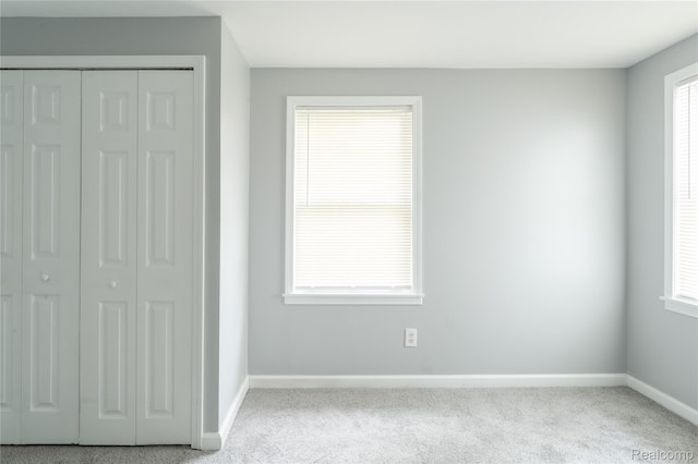 38204 Main St, New Baltimore, MI 48047 - unfurnished bedroom with baseboards, carpet floors, and a closet