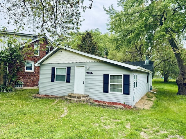 38204 Main St, New Baltimore, MI 48047 - view of front facade with a front lawn