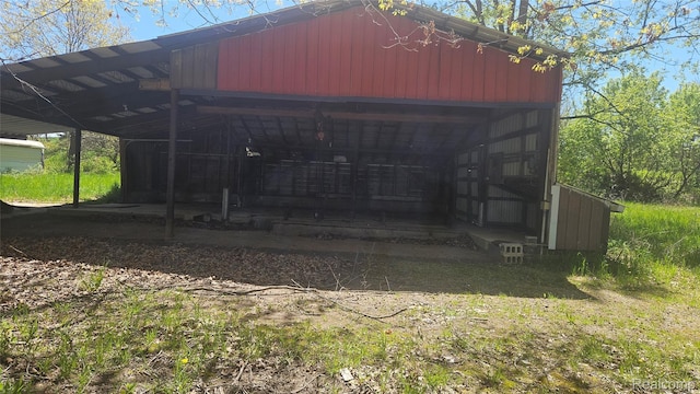 5820 Mack Rd, Howell, MI 48855 - view of pole building featuring a carport