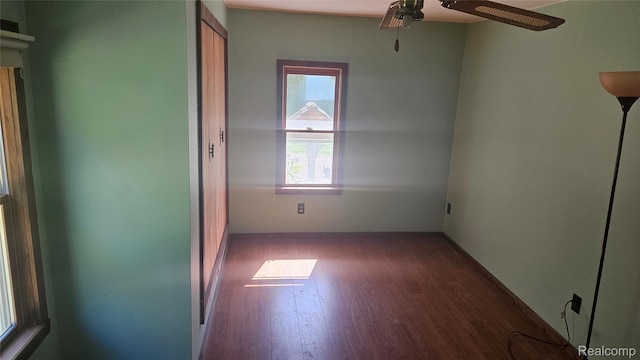 5820 Mack Rd, Howell, MI 48855 - spare room featuring wood finished floors, ceiling fan, and baseboards