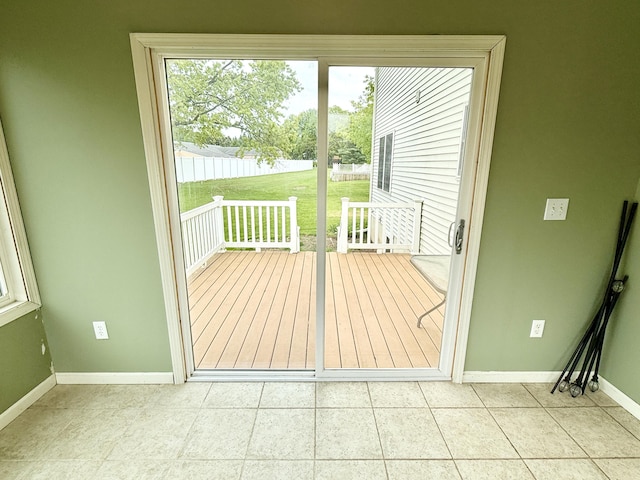6981 Jennifer Ln, Portland, MI 48875 - doorway with baseboards and tile patterned flooring