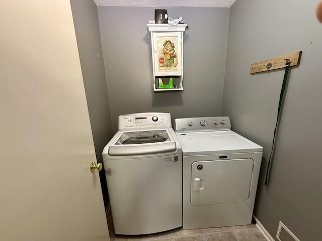 6981 Jennifer Ln, Portland, MI 48875 - laundry area with washing machine and dryer