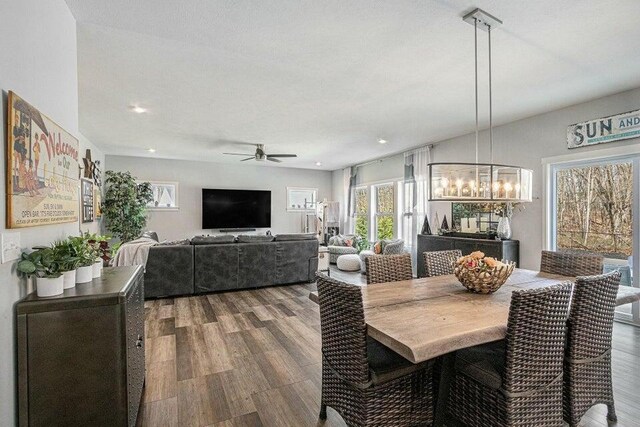 18734 Leonard Ct, New Buffalo, MI 49117 - dining area featuring a chandelier, a ceiling fan, wood finished floors, and recessed lighting