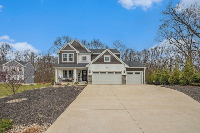 18734 Leonard Ct, New Buffalo, MI 49117 - craftsman inspired home with stone siding, covered porch, driveway, and a garage