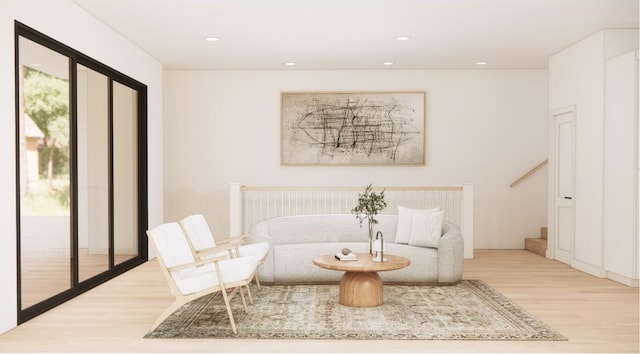 638 E Fulton St E Unit C2, Grand Rapids, MI 49503 - sitting room with wood finished floors, healthy amount of natural light, recessed lighting, and stairway