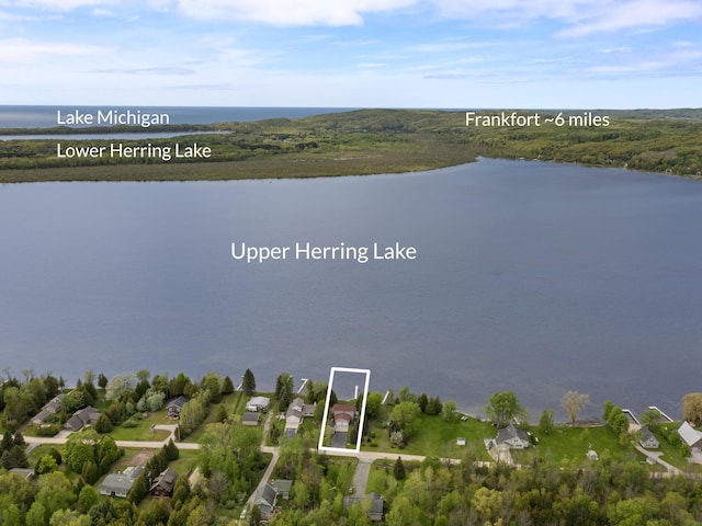 5384 Indian Trl, Frankfort, MI 49635 - aerial view of property's location featuring a large body of water and property boundaries highlighted