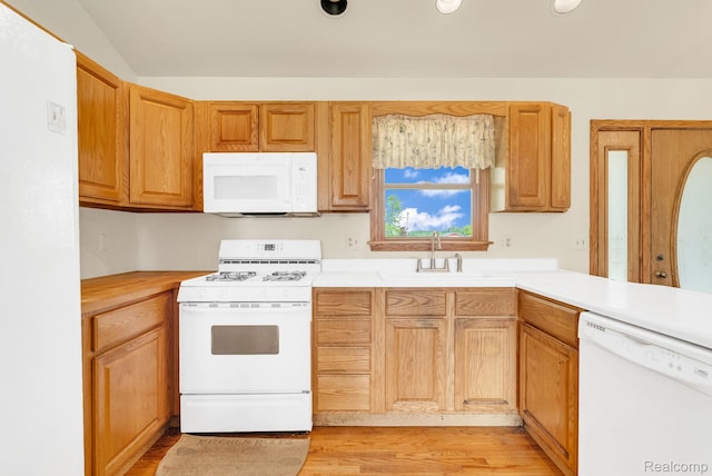 5562 Sheridan Line Rd, Croswell, MI 48422 - kitchen featuring white appliances, light countertops, and light wood-style floors