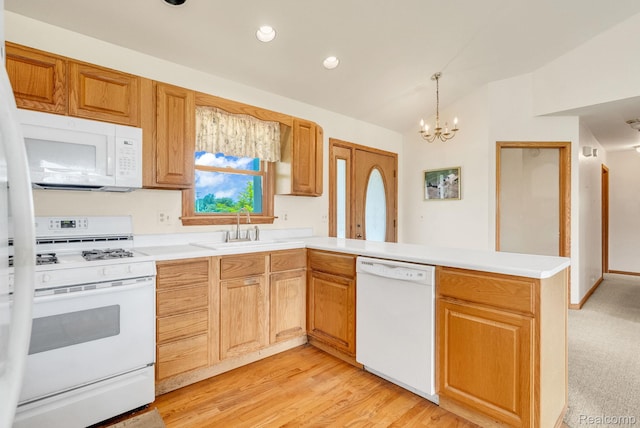 5562 Sheridan Line Rd, Croswell, MI 48422 - kitchen with white appliances, a peninsula, light countertops, a chandelier, and lofted ceiling