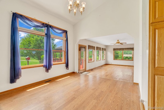 5562 Sheridan Line Rd, Croswell, MI 48422 - empty room with a chandelier, light wood-style floors, a ceiling fan, and lofted ceiling