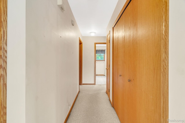 5562 Sheridan Line Rd, Croswell, MI 48422 - hall featuring light carpet and baseboards