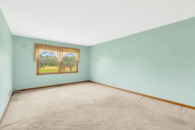 5562 Sheridan Line Rd, Croswell, MI 48422 - carpeted spare room featuring baseboards