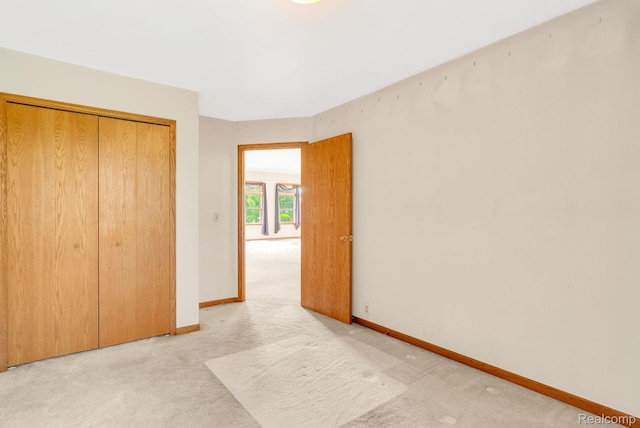 5562 Sheridan Line Rd, Croswell, MI 48422 - unfurnished bedroom with light carpet and a closet