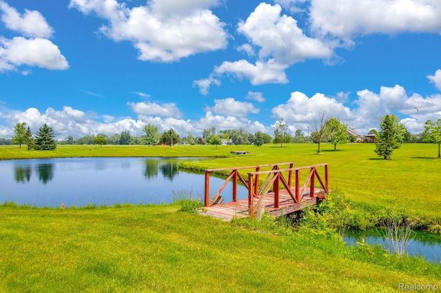 5562 Sheridan Line Rd, Croswell, MI 48422 - dock area with a lawn and a water view