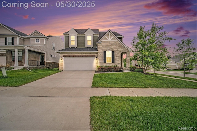 2979 Havre St, Ann Arbor, MI 48105 - view of front of property featuring stone siding, driveway, and a front lawn