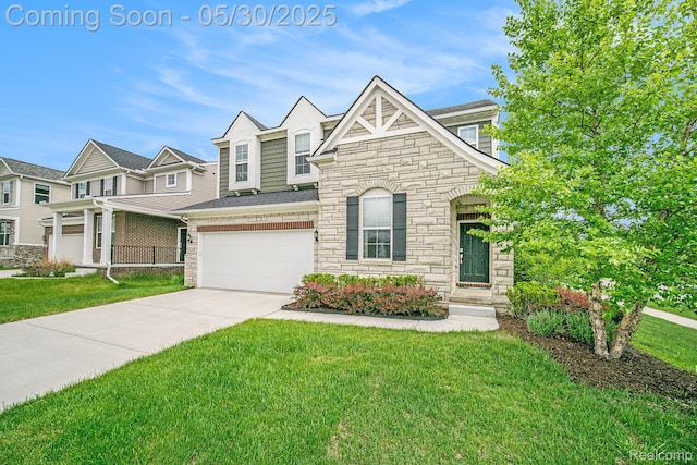 2979 Havre St, Ann Arbor, MI 48105 - view of front of home with stone siding, a front yard, an attached garage, and driveway