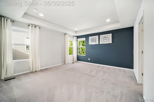 2979 Havre St, Ann Arbor, MI 48105 - empty room featuring a tray ceiling, carpet floors, baseboards, recessed lighting, and a smoke detector