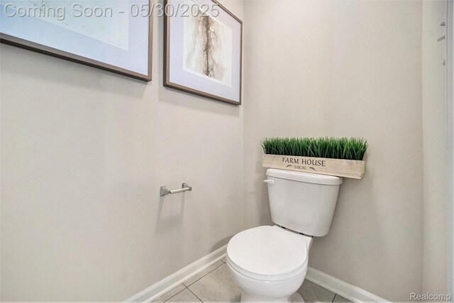2979 Havre St, Ann Arbor, MI 48105 - bathroom with baseboards, toilet, and tile patterned floors