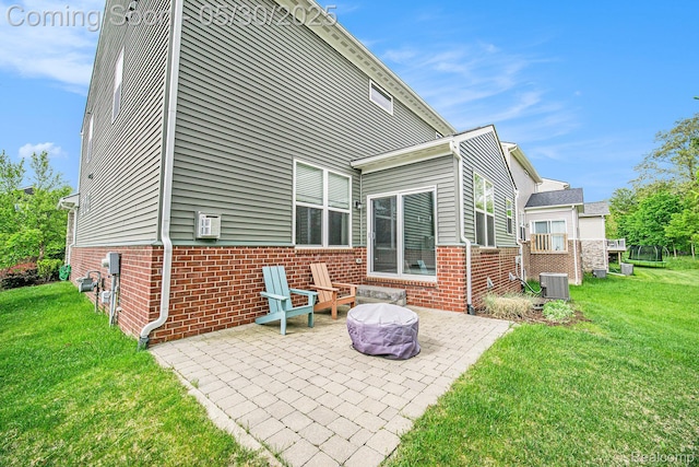 2979 Havre St, Ann Arbor, MI 48105 - back of house with a patio area, brick siding, a yard, and central AC unit