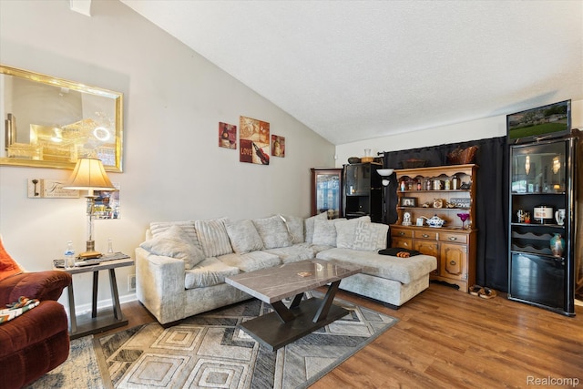 3307 Mackin Rd, Flint, MI 48504 - living room featuring lofted ceiling and wood finished floors