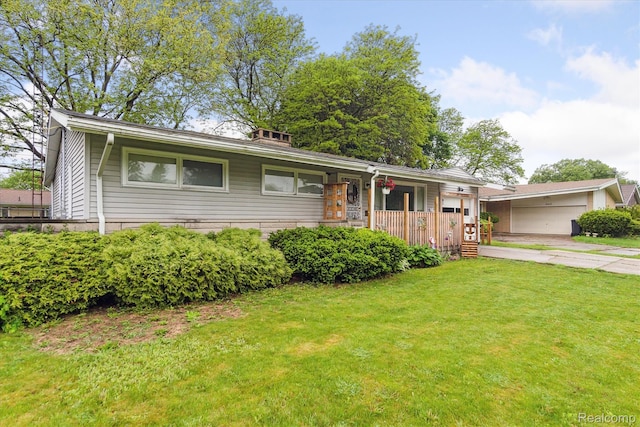3307 Mackin Rd, Flint, MI 48504 - ranch-style house featuring a front lawn, a porch, concrete driveway, and a carport