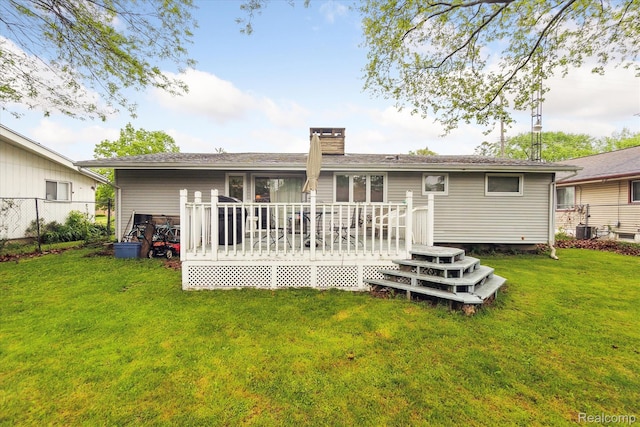 3307 Mackin Rd, Flint, MI 48504 - back of property featuring a chimney and a deck