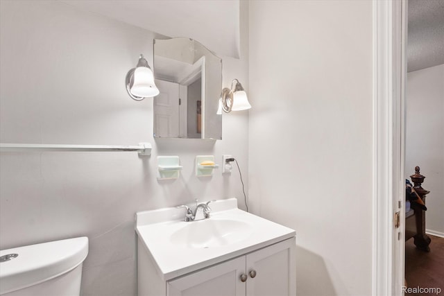 3307 Mackin Rd, Flint, MI 48504 - bathroom with vanity and toilet