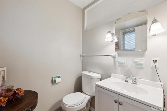 3307 Mackin Rd, Flint, MI 48504 - bathroom featuring toilet and vanity