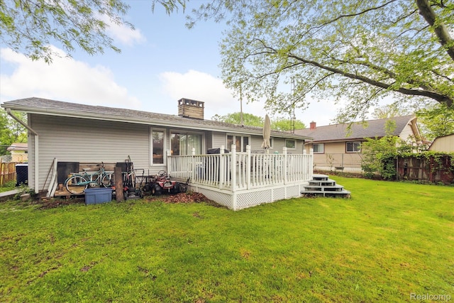 3307 Mackin Rd, Flint, MI 48504 - rear view of property featuring a deck and a chimney