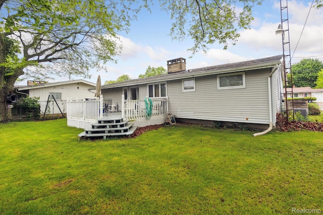 3307 Mackin Rd, Flint, MI 48504 - back of property featuring a chimney and a deck
