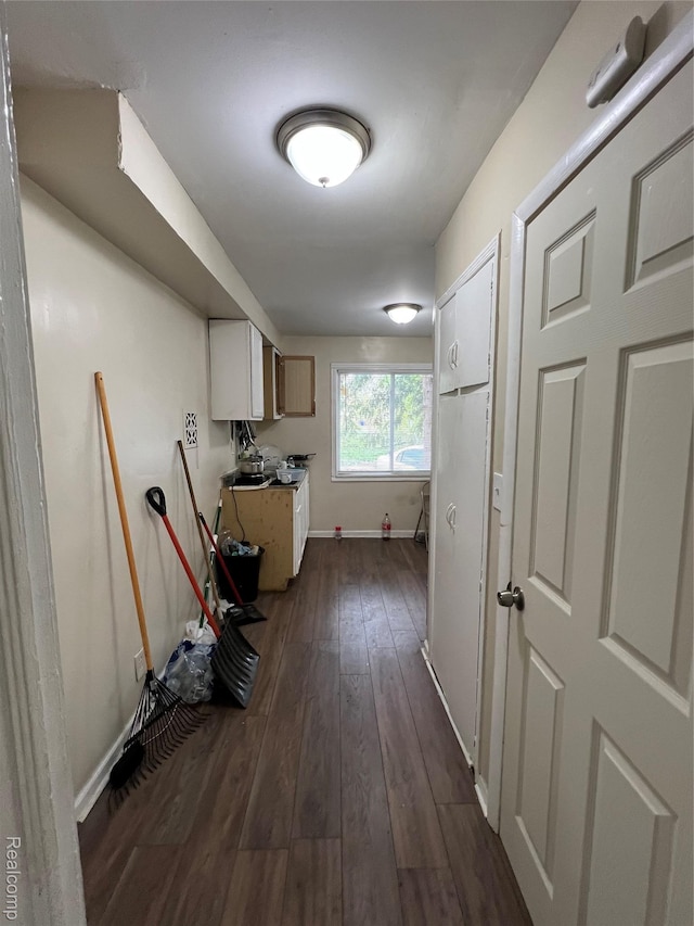 11106 Nottingham Rd, Detroit, MI 48224 - laundry area featuring baseboards and dark wood finished floors