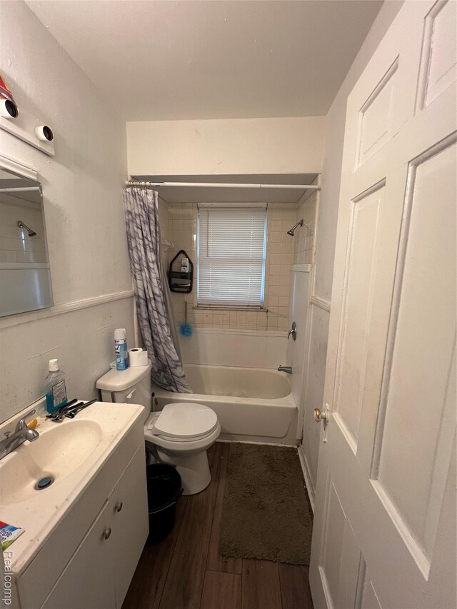 11106 Nottingham Rd, Detroit, MI 48224 - full bathroom featuring vanity, wood finished floors, shower / tub combo, and toilet