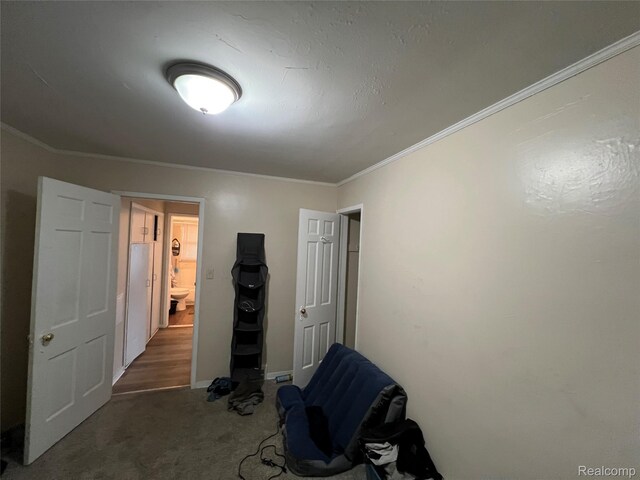 11106 Nottingham Rd, Detroit, MI 48224 - unfurnished bedroom with carpet flooring, ornamental molding, and baseboards