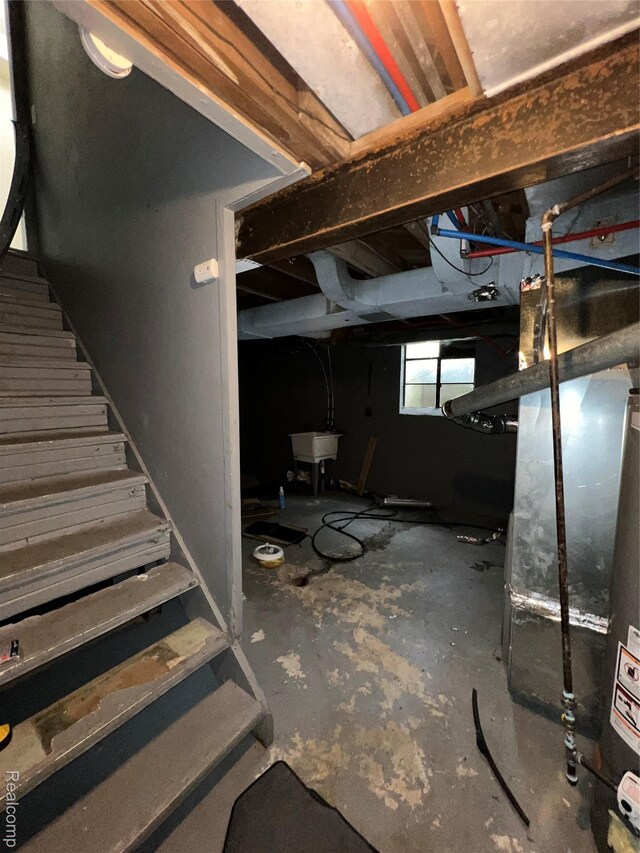 11106 Nottingham Rd, Detroit, MI 48224 - below grade area with a sink, stairs, and heating unit