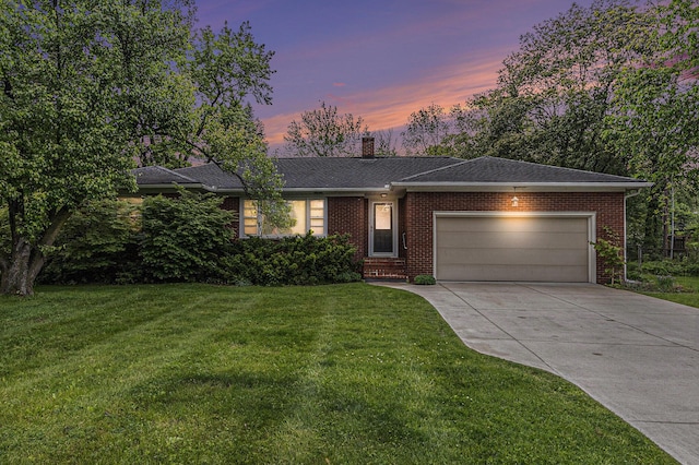 135 Barton Dr, Ann Arbor, MI 48105 - ranch-style house featuring a garage, concrete driveway, a front yard, and brick siding