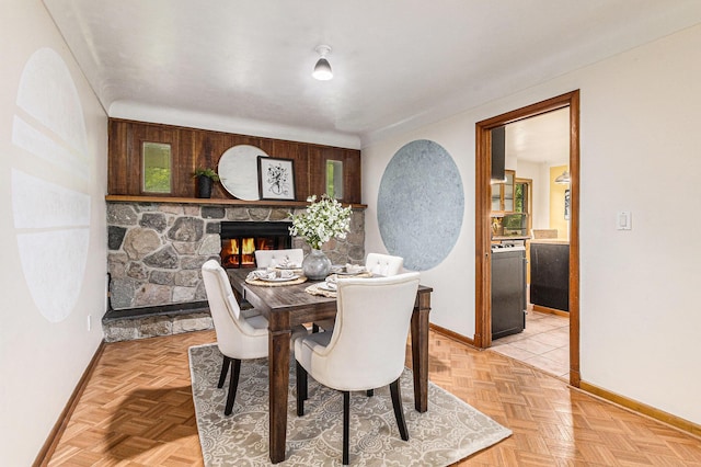 135 Barton Dr, Ann Arbor, MI 48105 - dining room with baseboards and a fireplace