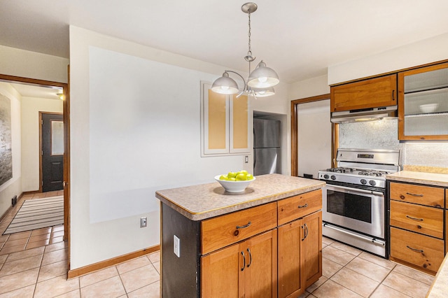 135 Barton Dr, Ann Arbor, MI 48105 - kitchen with appliances with stainless steel finishes, under cabinet range hood, light tile patterned floors, a chandelier, and light countertops